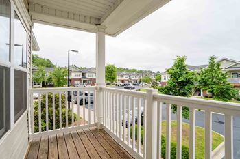 Balcony overlooking a residential street.